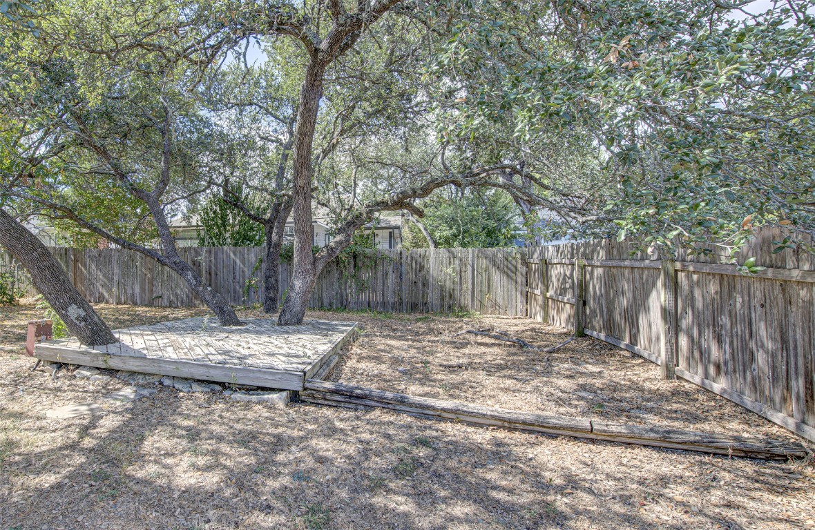 1401 Deepwoods Trail Leander, TX 78641 - Photo 31 of 34 a backyard of a house with table and chairs