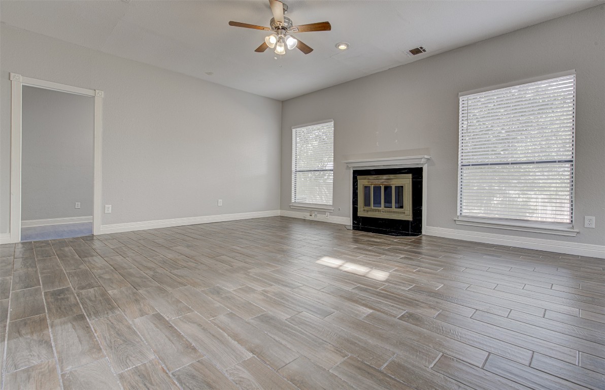 1401 Deepwoods Trail Leander, TX 78641 - Photo 8 of 34 a view of an empty room with a window and fireplace