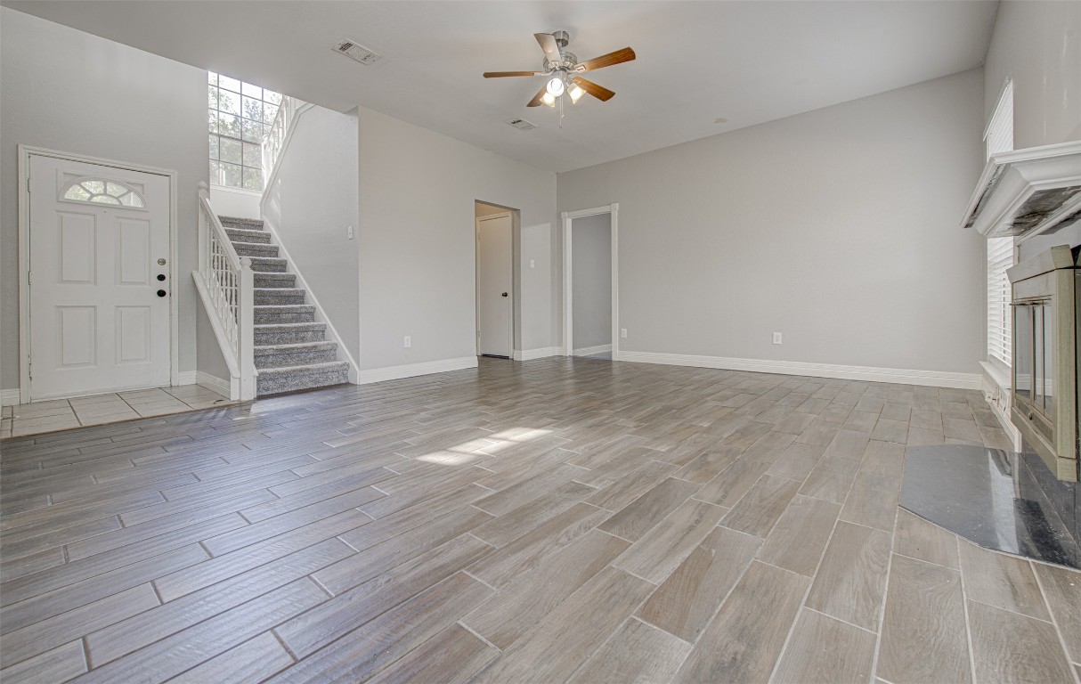 1401 Deepwoods Trail Leander, TX 78641 - Photo 9 of 34 wooden floor in an empty room with a window