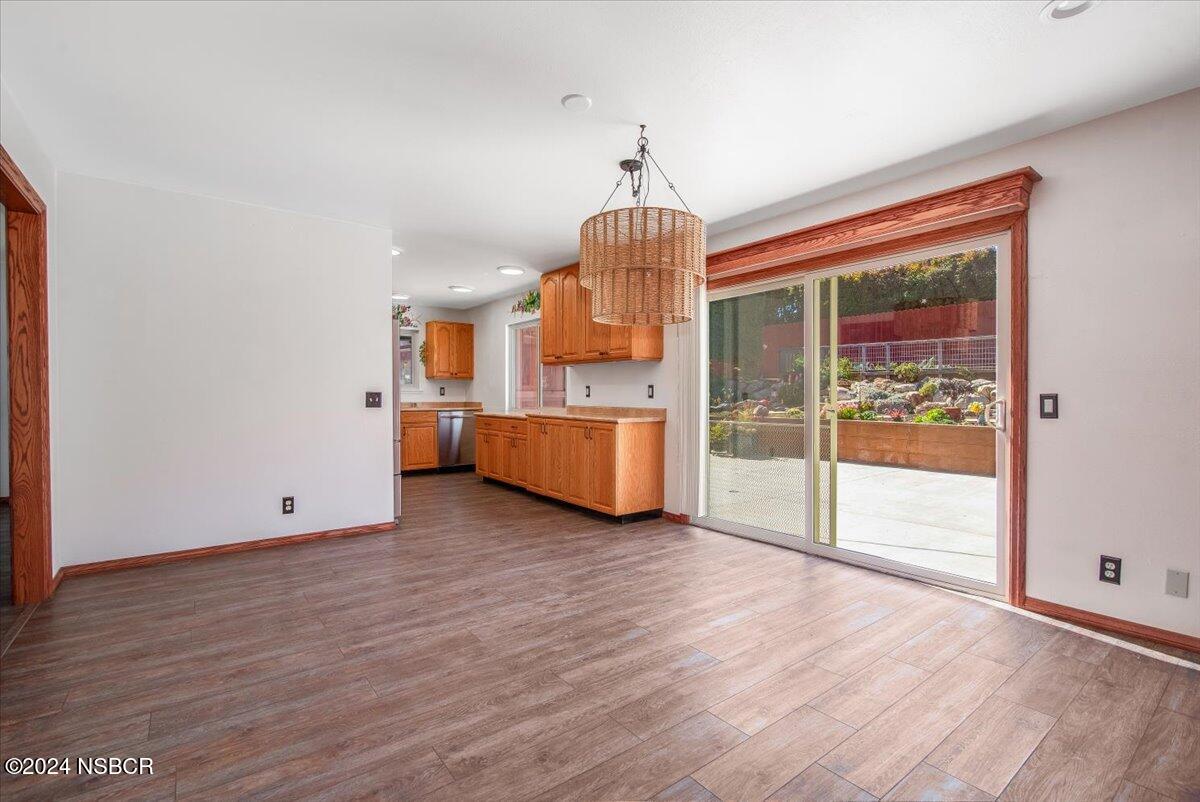 313 Somerset Place Lompoc, CA 93436 - Photo 16 of 59 a view of a room with wooden floor and windows