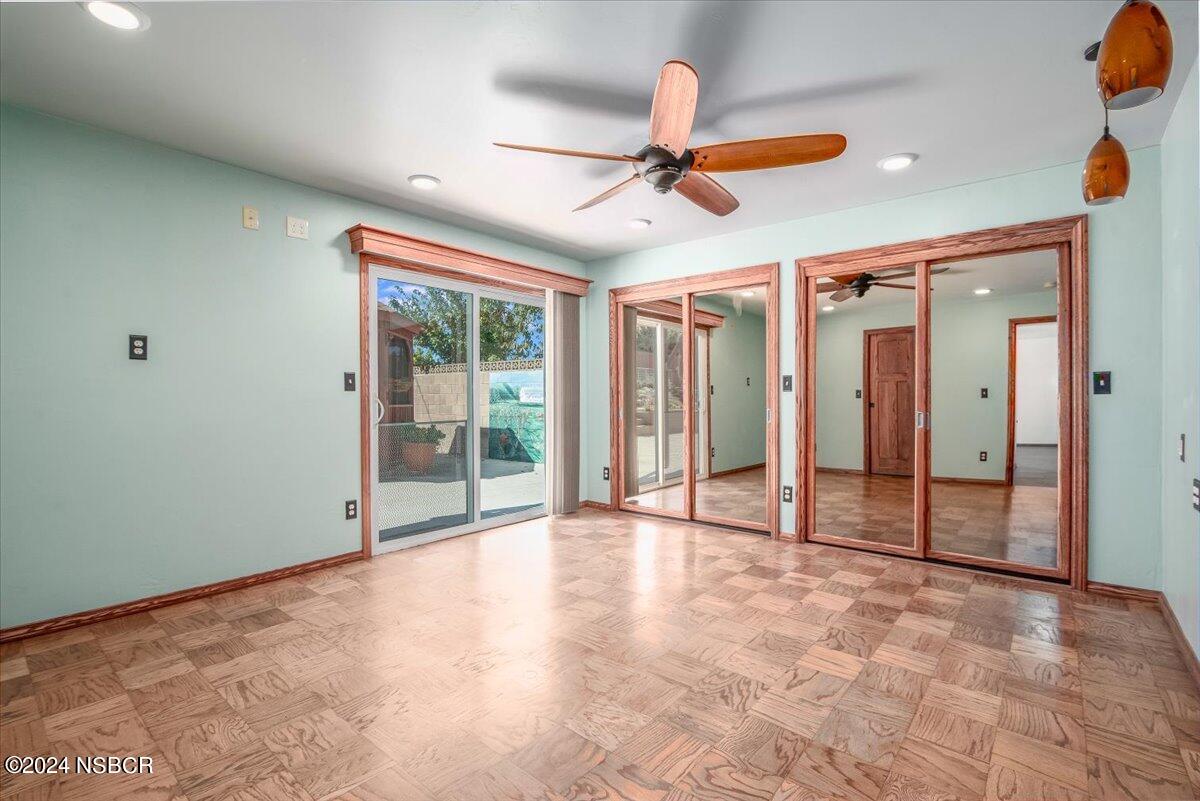 313 Somerset Place Lompoc, CA 93436 - Photo 21 of 59 a view of an empty room with window and chandelier fan