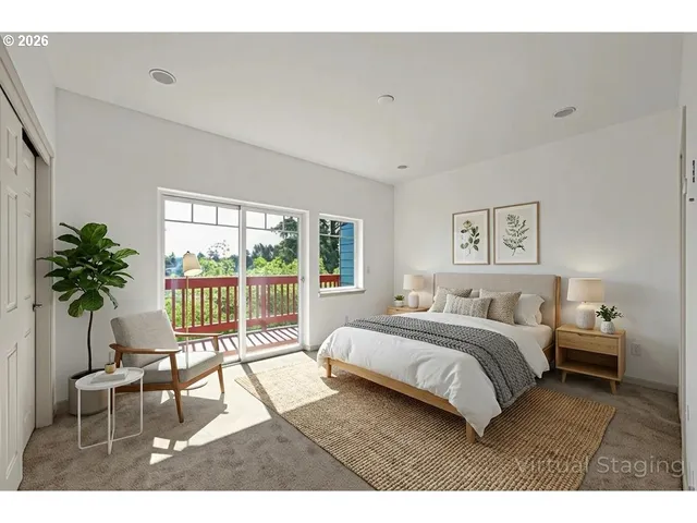 a bedroom with a large bed and a potted plant