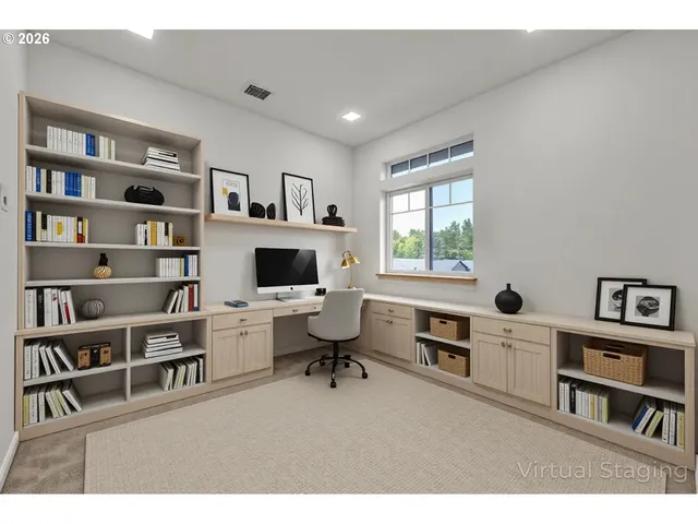 a living room with furniture and a book shelf