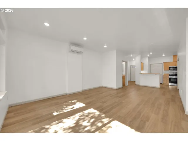 a view of a kitchen with a sink and a stove