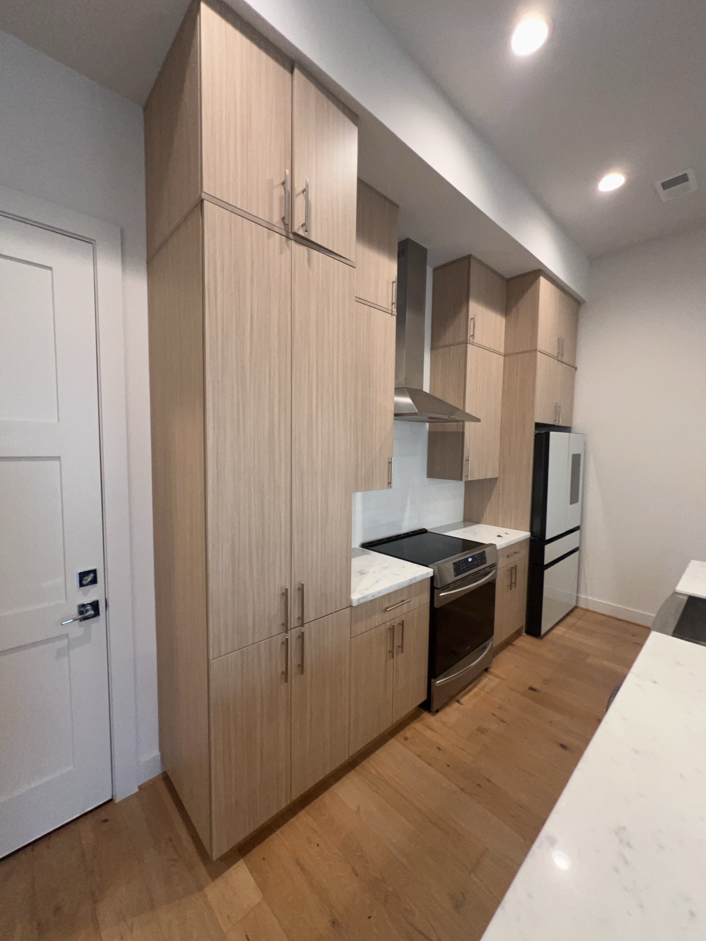 2414 Gray Street Houston, TX 77003 - Photo 2 of 14 a kitchen with stainless steel appliances granite countertop a refrigerator and a stove top oven