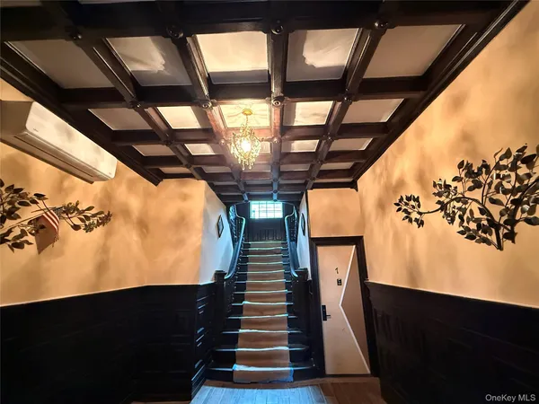 a view of a hallway with staircase