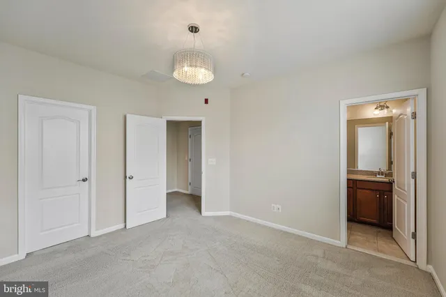 an empty room with closet area