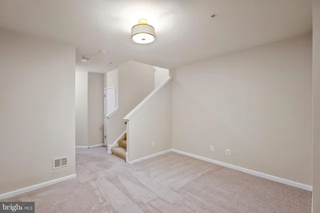 a view of a hallway with staircase
