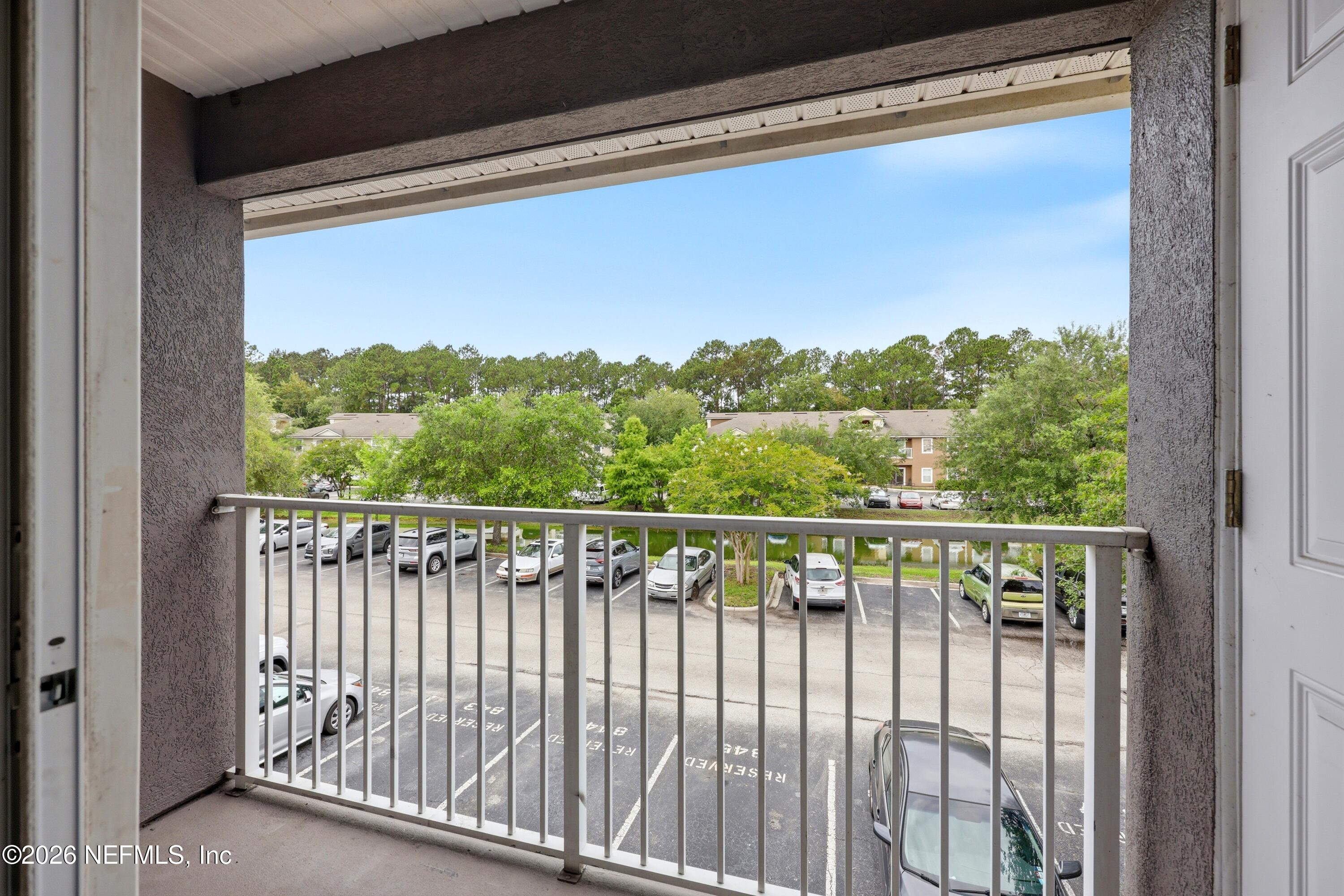 7920 Merrill Road, Unit 411 Jacksonville, FL 32277 - Photo 24 of 36 Balcony with Pond View