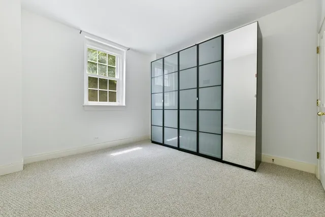 an empty room with a empty space and window