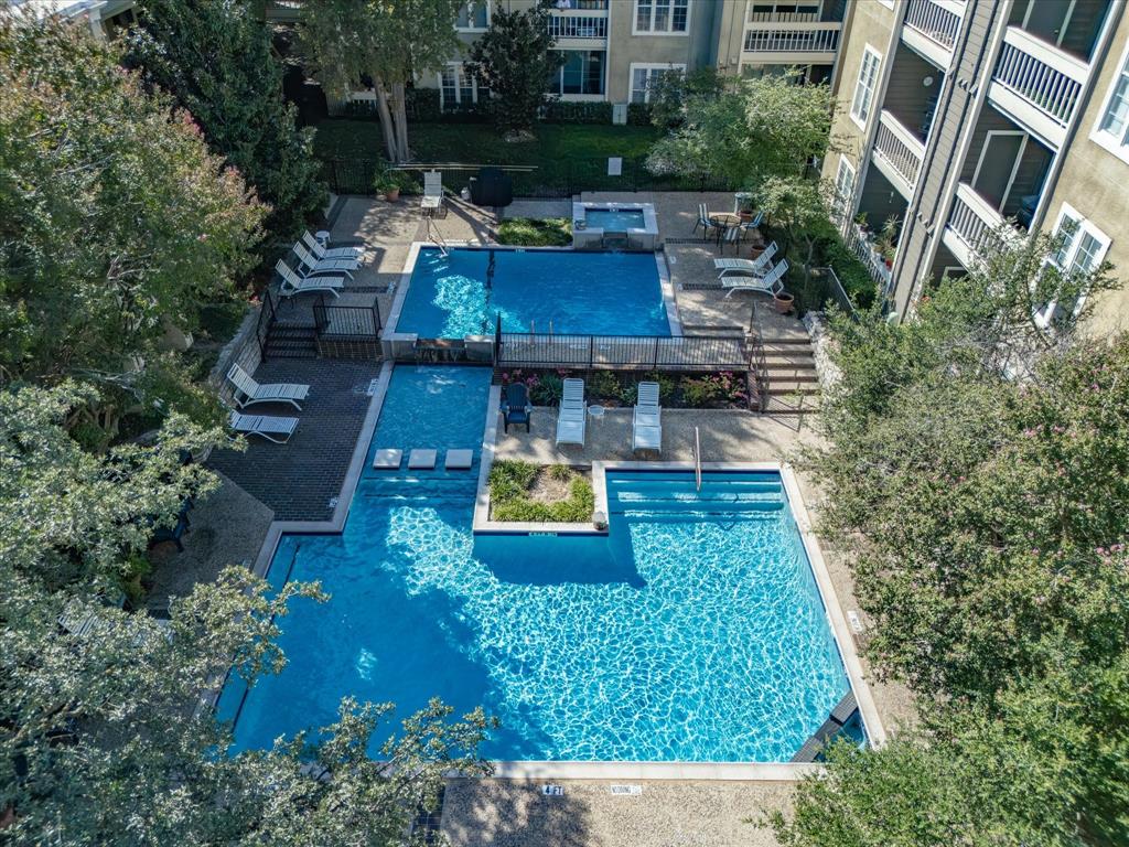 5310 Keller Springs Road, Unit 332 Dallas, TX 75248 - Photo 35 of 39 Community pool with a patio area, stairway, and a community hot tub