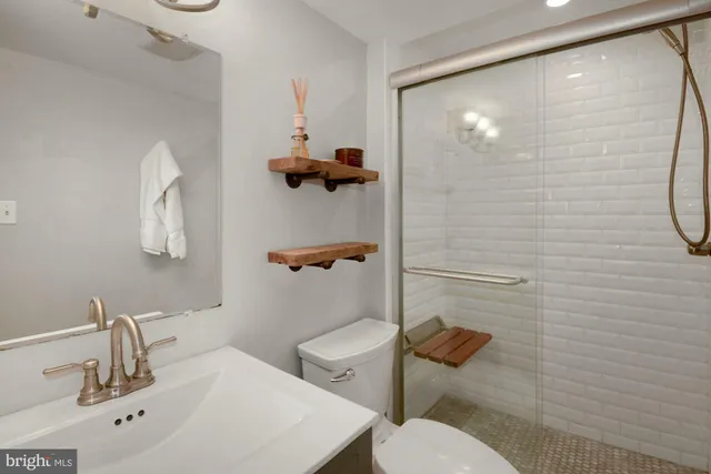 a bedroom with a bed and a lamp on table