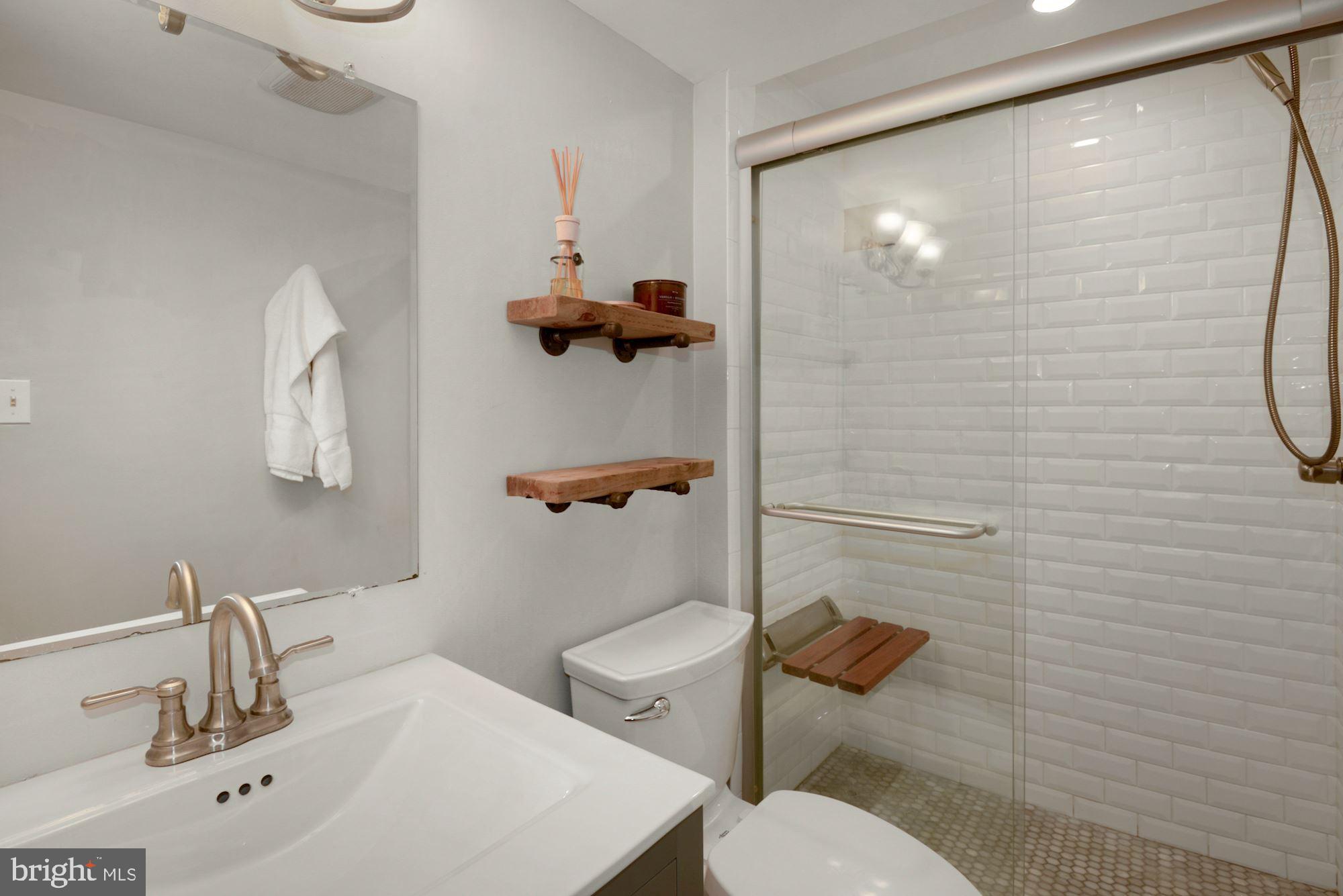 1718 Corcoran Street Northwest, Unit 5 Washington, DC 20009 - Photo 12 of 23 a bathroom with a sink mirror toilet and shower