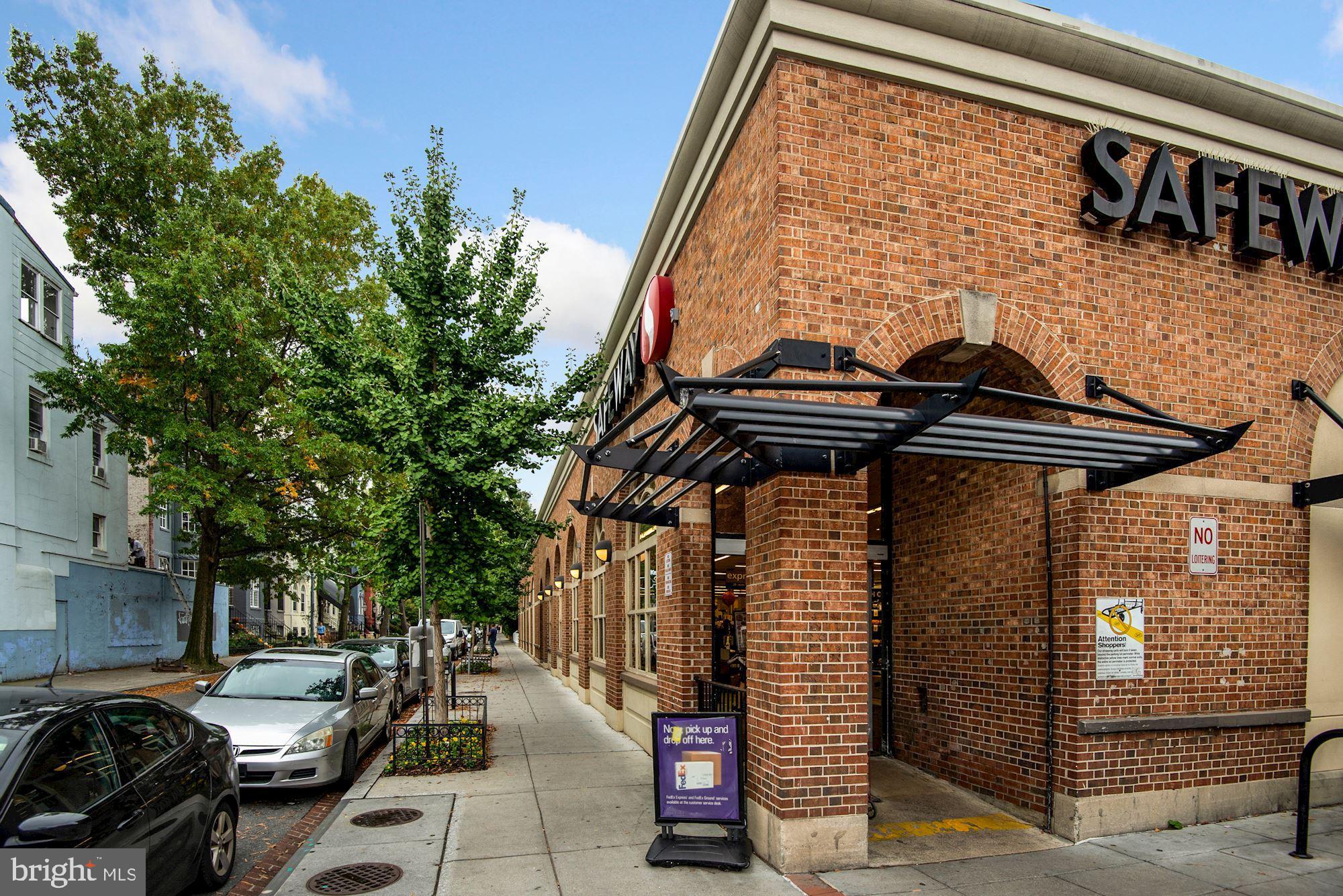 1718 Corcoran Street Northwest, Unit 5 Washington, DC 20009 - Photo 21 of 23 a couple of cars parked in front of a house