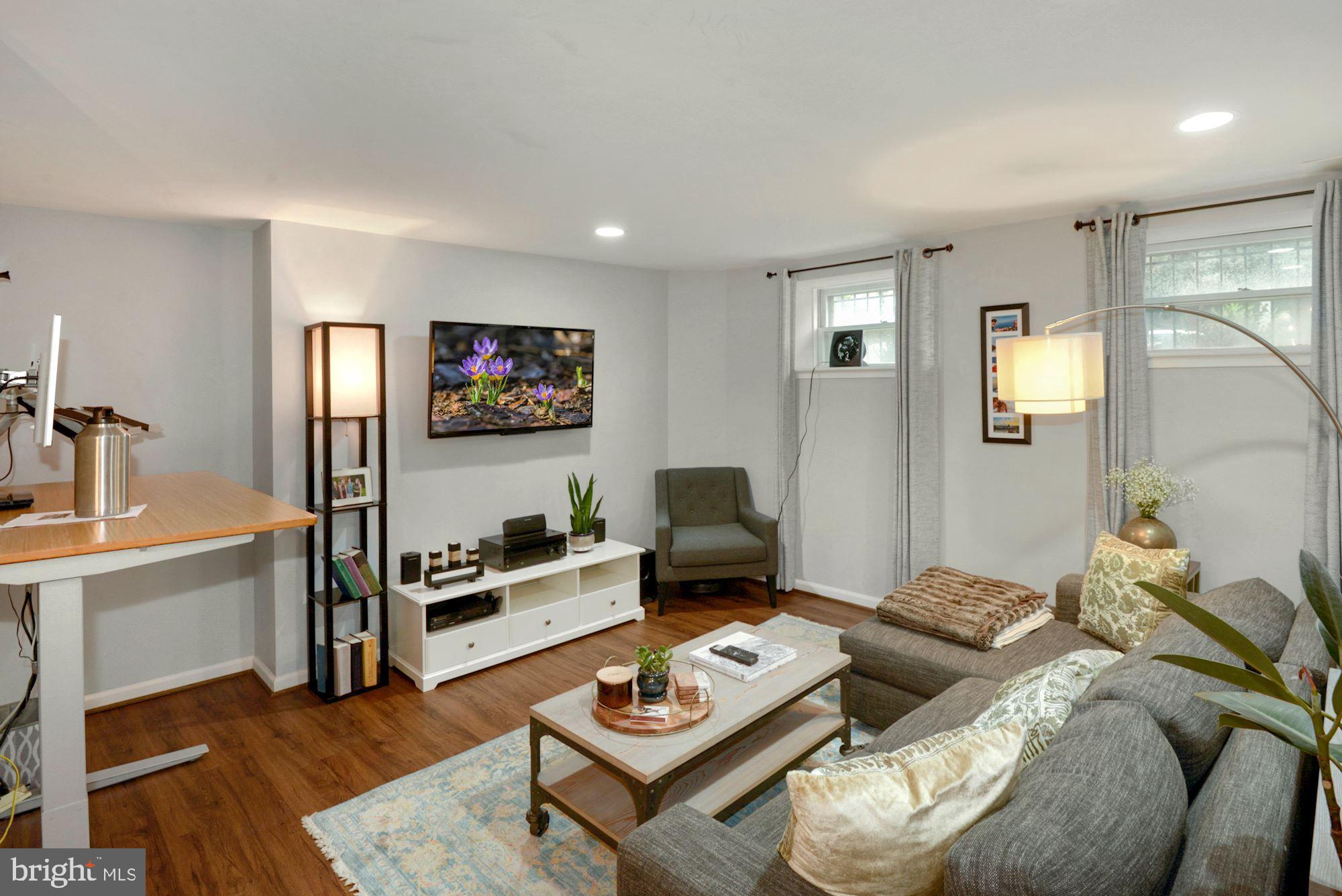 1718 Corcoran Street Northwest, Unit 5 Washington, DC 20009 - Photo 8 of 23 a living room with furniture and a wooden floor