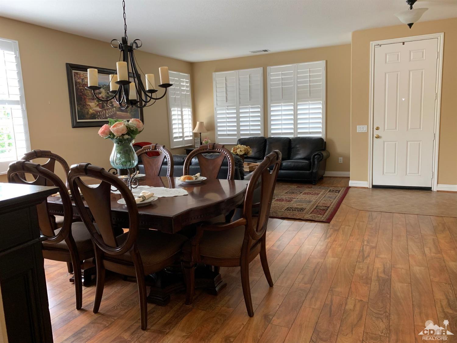 37503 Haweswater Road Indio, CA 92203 - Photo 3 of 19 a view of a dining room with furniture window and wooden floor