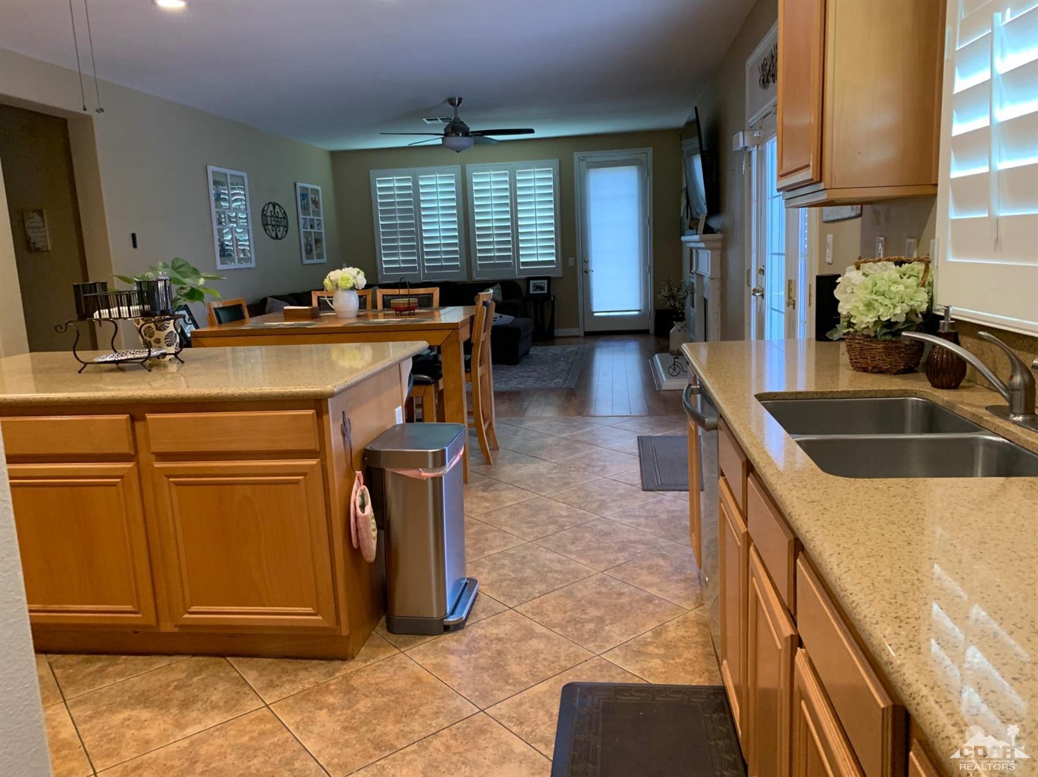 37503 Haweswater Road Indio, CA 92203 - Photo 5 of 19 a kitchen with sink cabinets and outdoor