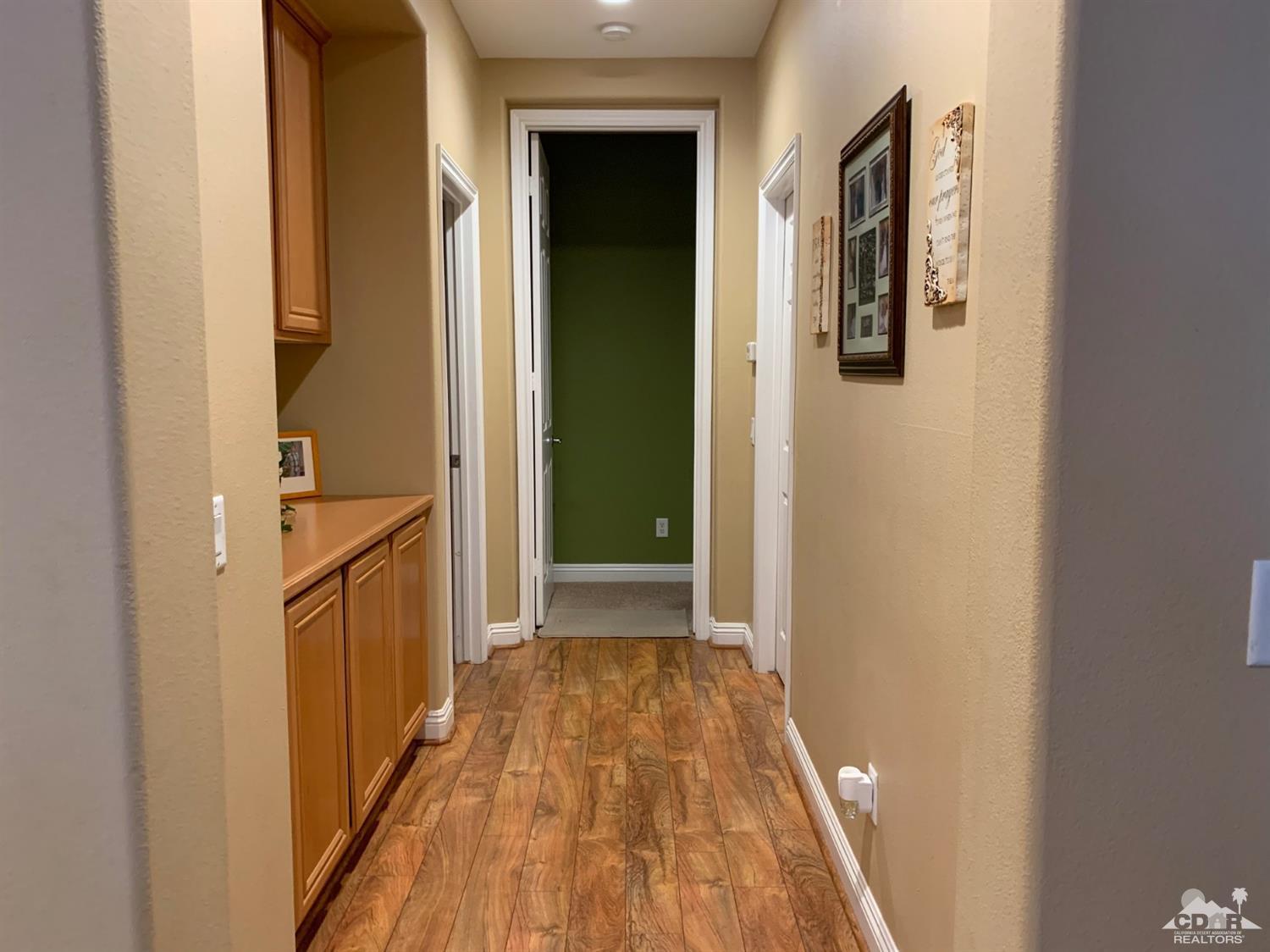 37503 Haweswater Road Indio, CA 92203 - Photo 7 of 19 a view of a hallway with wooden floor