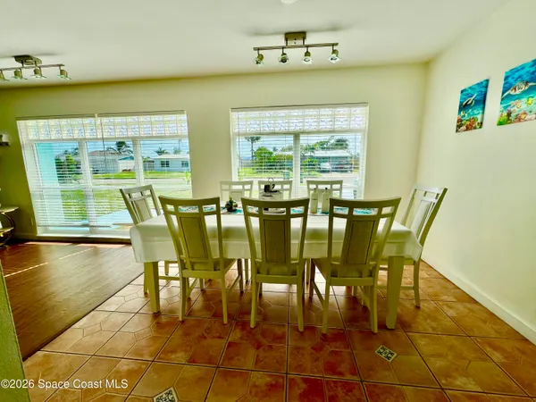 a view of a dining room with furniture window and outside view