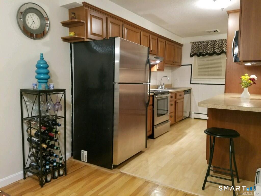 54 Berkshire Road West Hartford, CT 06107 - Photo 6 of 26 Cooking is a breeze in your sleek, modern kitchen complete with SS Appliances