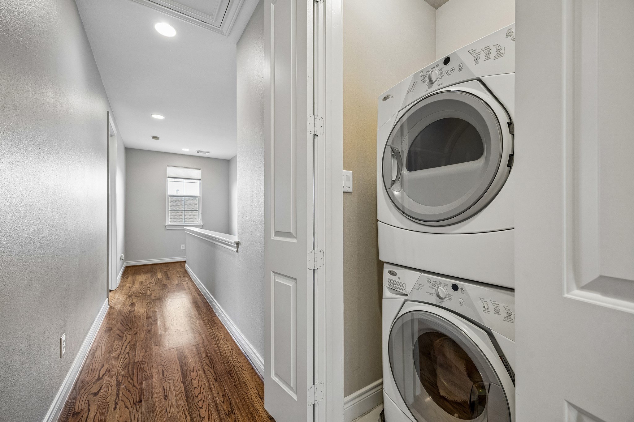 622 Rutland Street, Unit D Houston, TX 77007 - Photo 20 of 27 Convenient in-home utility area with stacked washer and dryer. Located on the upper level for easy access to bedrooms. Functional design maximizes space and efficiency.