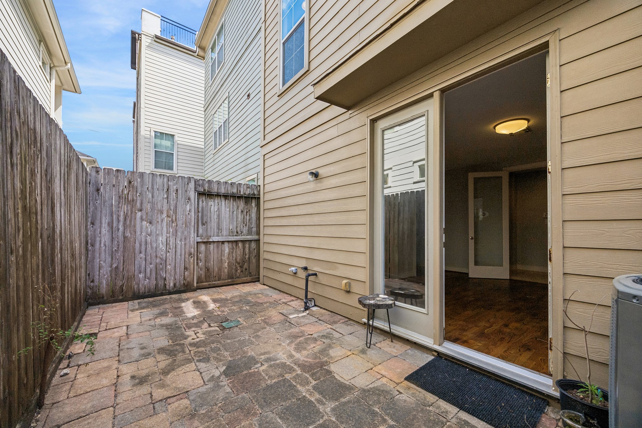 622 Rutland Street, Unit D Houston, TX 77007 - Photo 21 of 27 Private outdoor patio with low-maintenance paver surface and fenced for added privacy. Ideal for relaxing, grilling, or enjoying outdoor dining. Direct access to interior living space enhances indoor-outdoor flow.