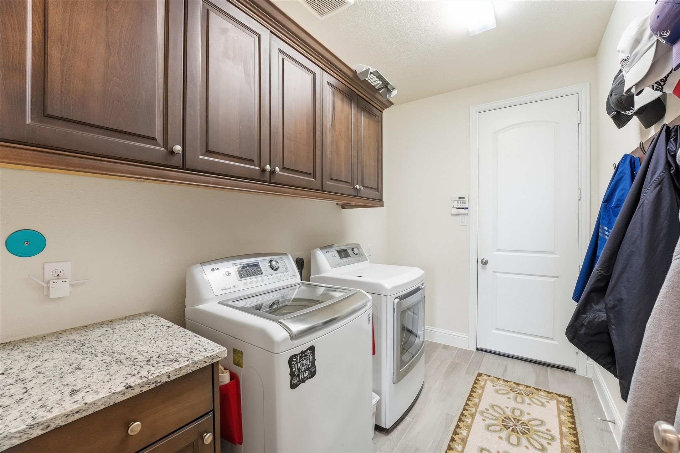 9307 Providence Bend Lane Houston, TX 77365 - Photo 33 of 45 Laundry room with abundant storage and room for a second fridge/freezer