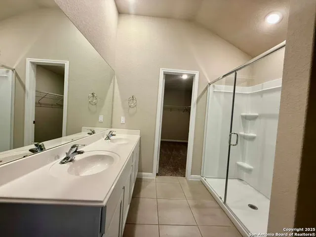 a bathroom with a sink and mirror