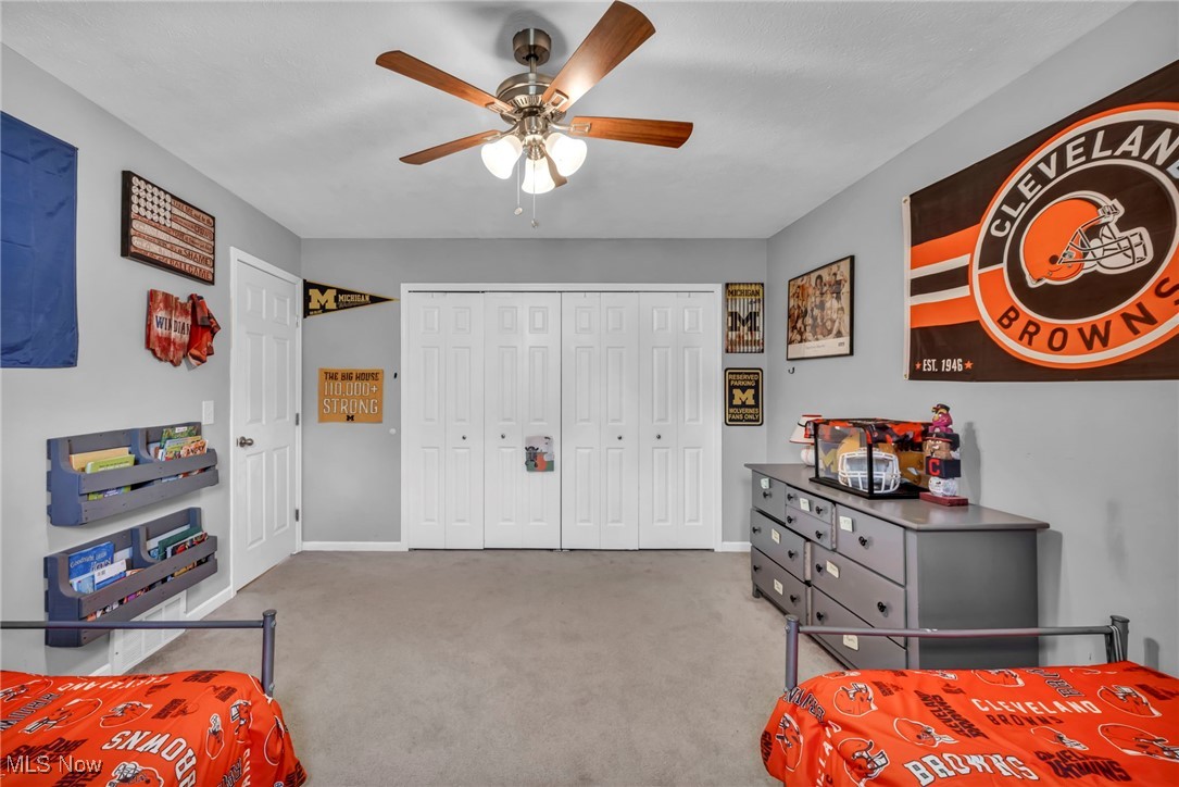 18945 Thorpe Road Chagrin Falls, OH 44023 - Photo 34 of 35 Bedroom with light carpet, a closet, and a ceiling fan