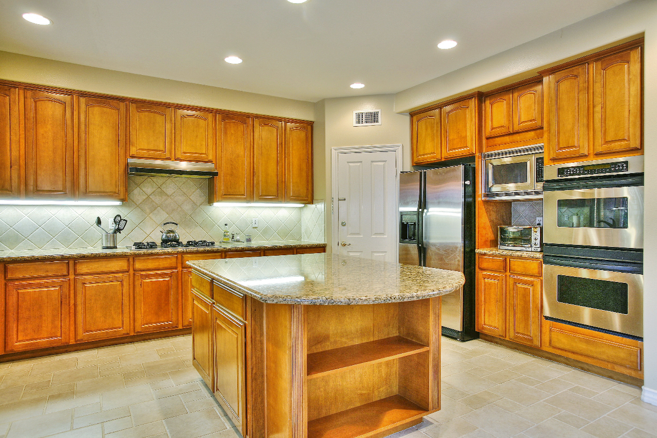 287 King Daniel Lane Goleta, CA 93117 - Photo 3 of 11 a kitchen with stainless steel appliances granite countertop a sink and cabinets