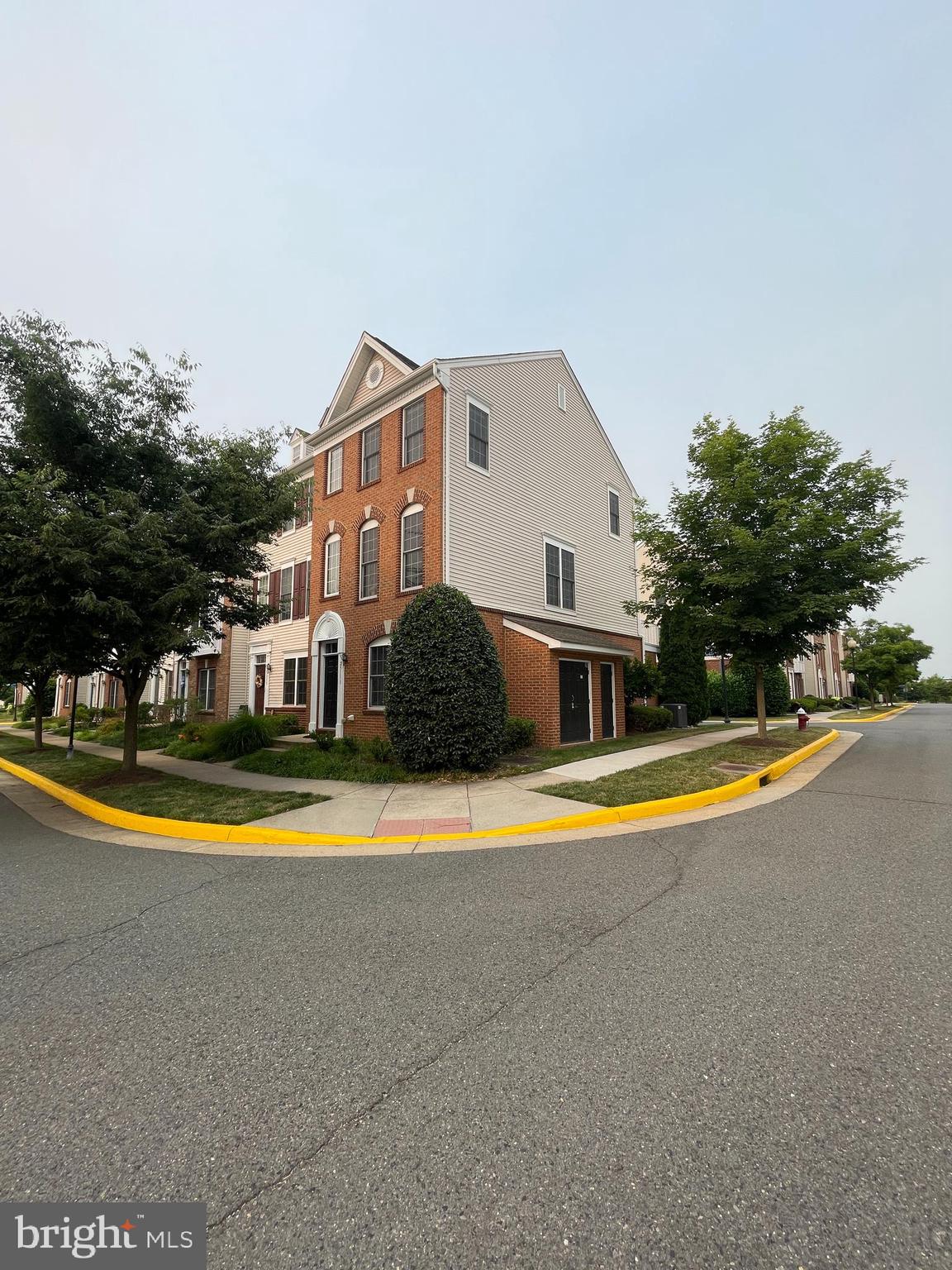 a view of a house with swimming pool and a yard