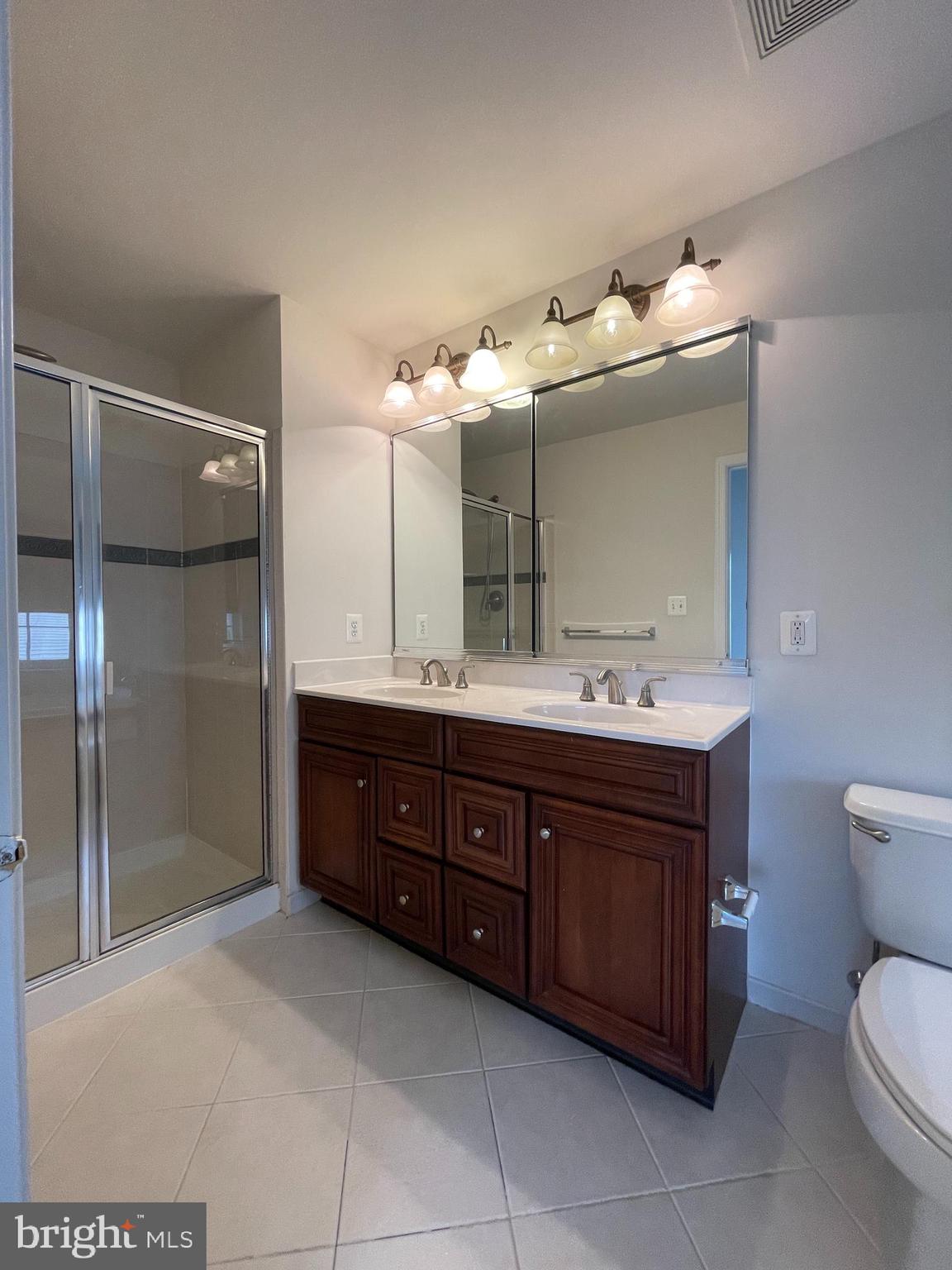 25111 Monteith Terrace Chantilly, VA 20152 - Photo 13 of 34 a spacious bathroom with a double vanity sink mirror and toilet