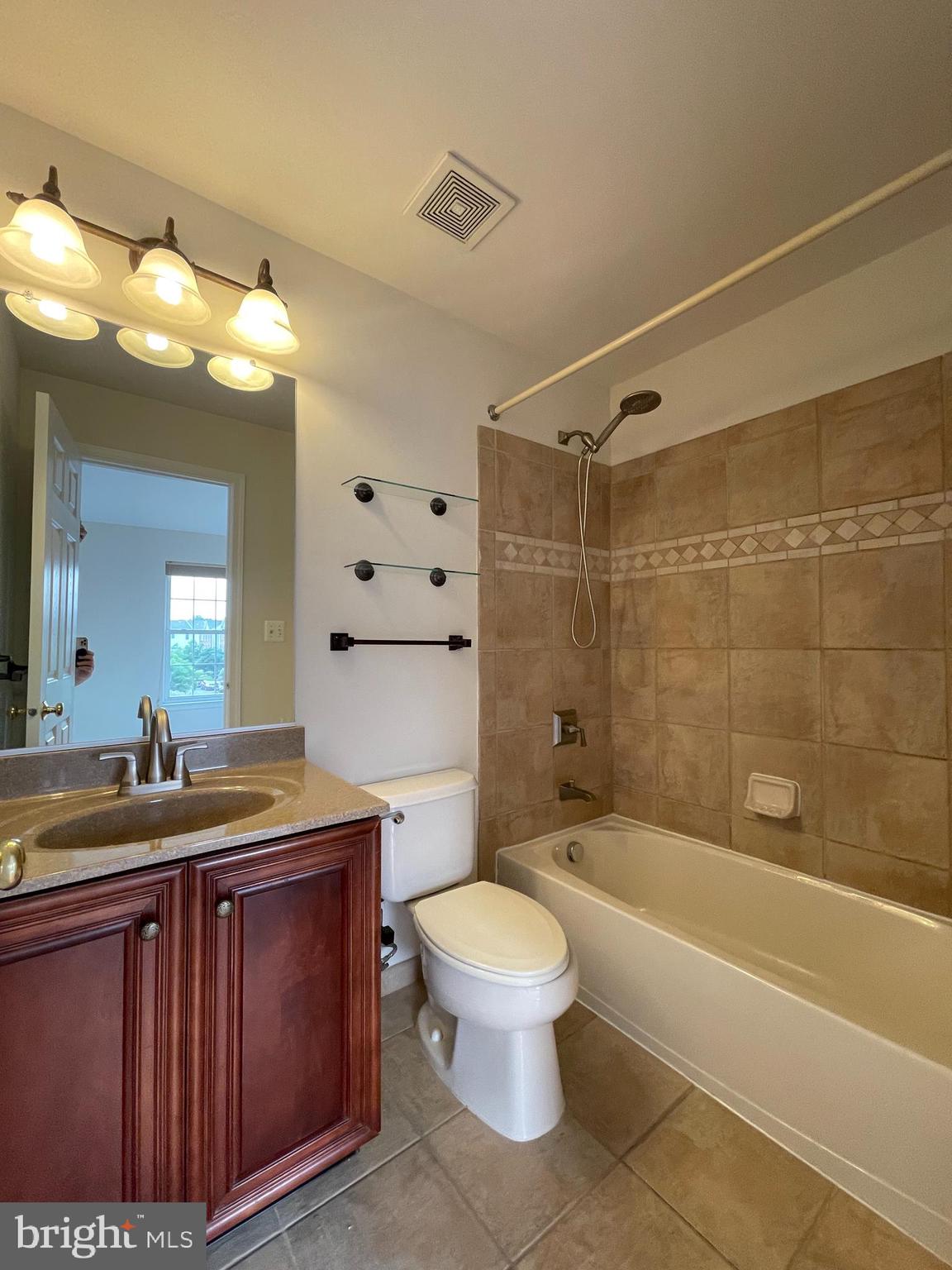 25111 Monteith Terrace Chantilly, VA 20152 - Photo 18 of 34 a bathroom with a sink a toilet and shower