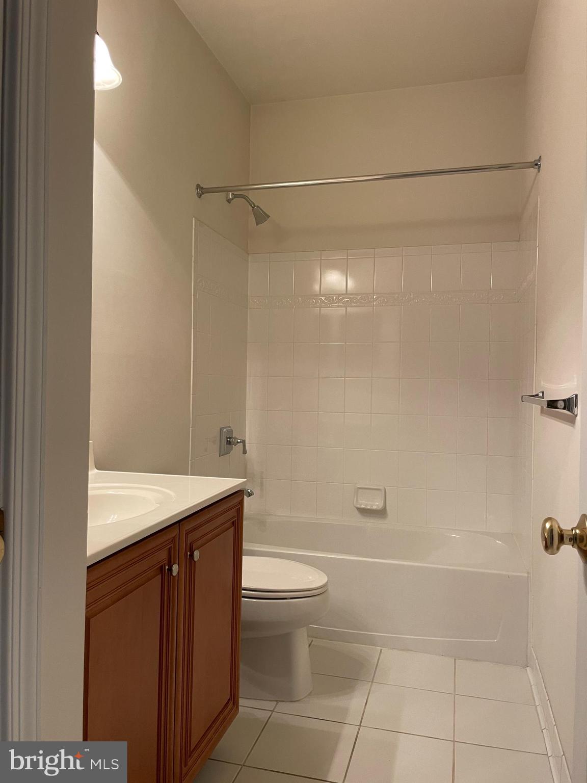 25111 Monteith Terrace Chantilly, VA 20152 - Photo 29 of 34 a bathroom with a granite countertop bathtub shower sink vanity and toilet