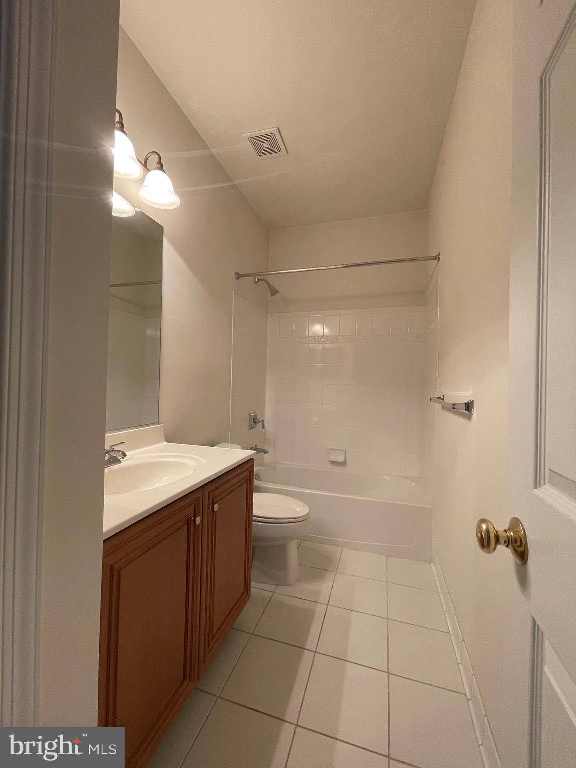 25111 Monteith Terrace Chantilly, VA 20152 - Photo 32 of 34 a bathroom with a granite countertop sink a toilet and shower