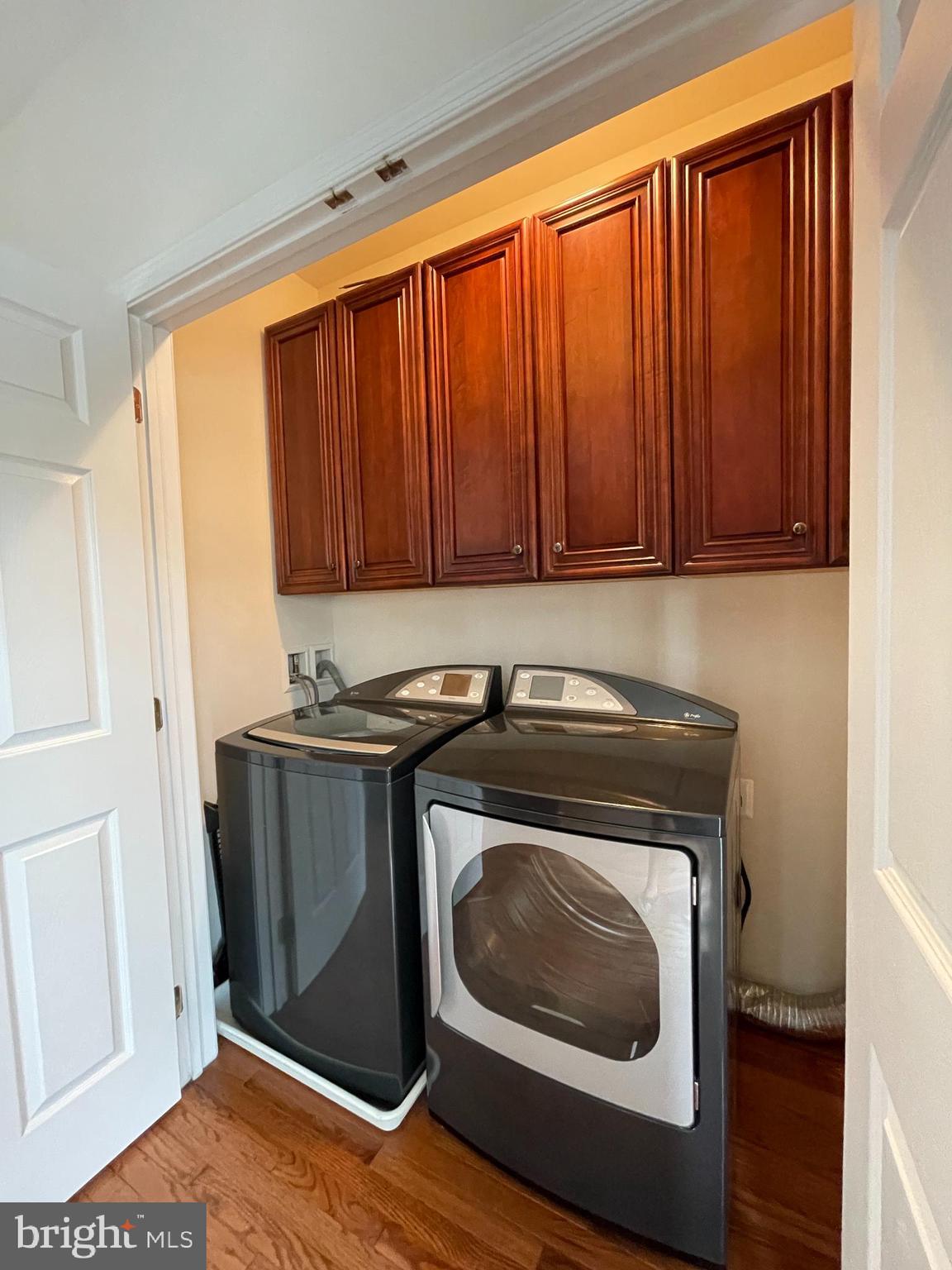 25111 Monteith Terrace Chantilly, VA 20152 - Photo 34 of 34 a utility room with wooden floor washer and dryer