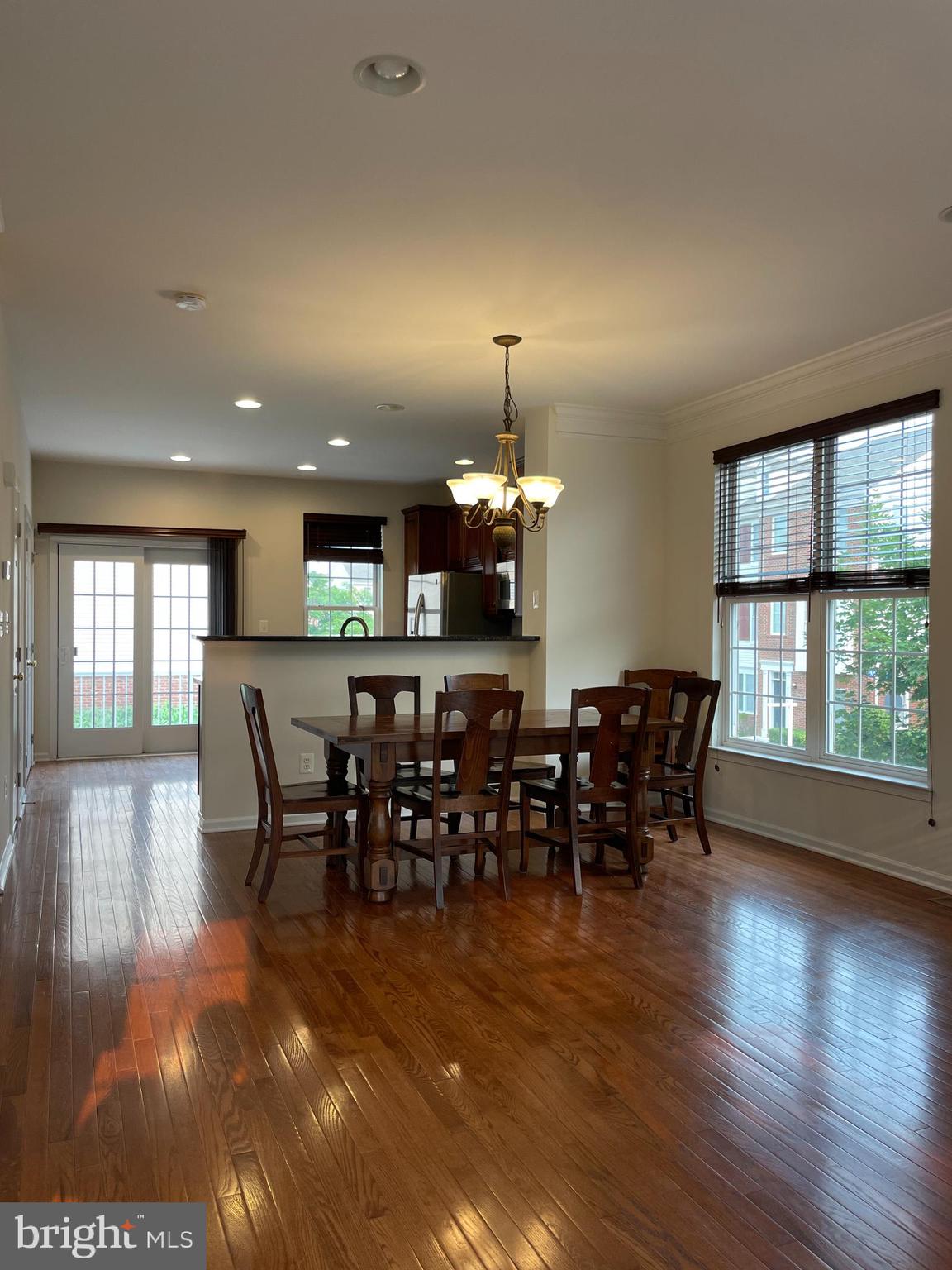 25111 Monteith Terrace Chantilly, VA 20152 - Photo 8 of 34 a view of a dining room with furniture window and wooden floor