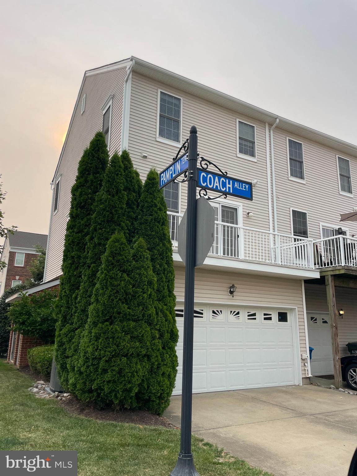 25111 Monteith Terrace Chantilly, VA 20152 - Photo 9 of 34 a front view of a house with a garden