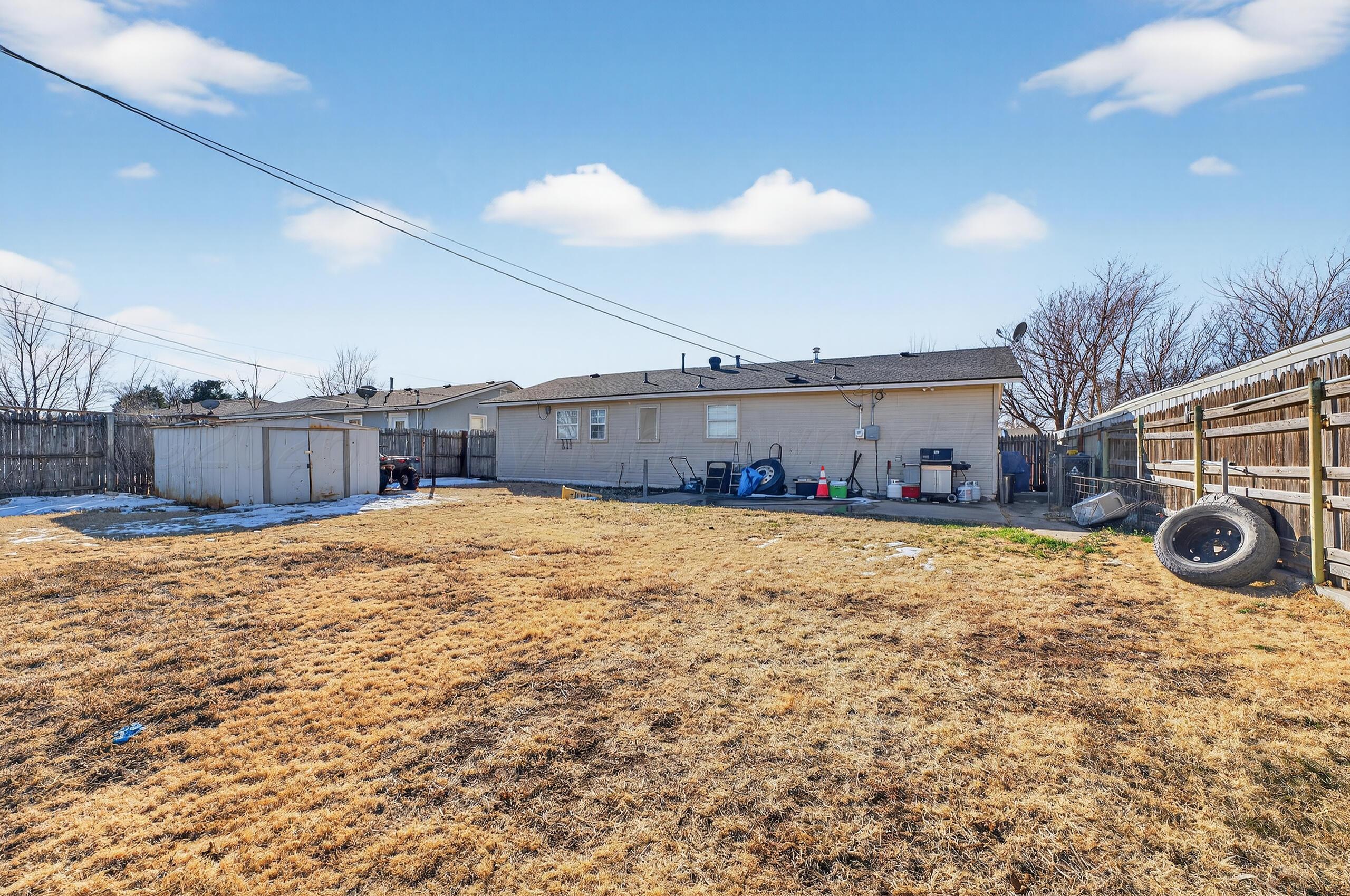 1007 Tudor Drive Amarillo, TX 79104 - Photo 25 of 27 a view of an house with backyard space and balcony
