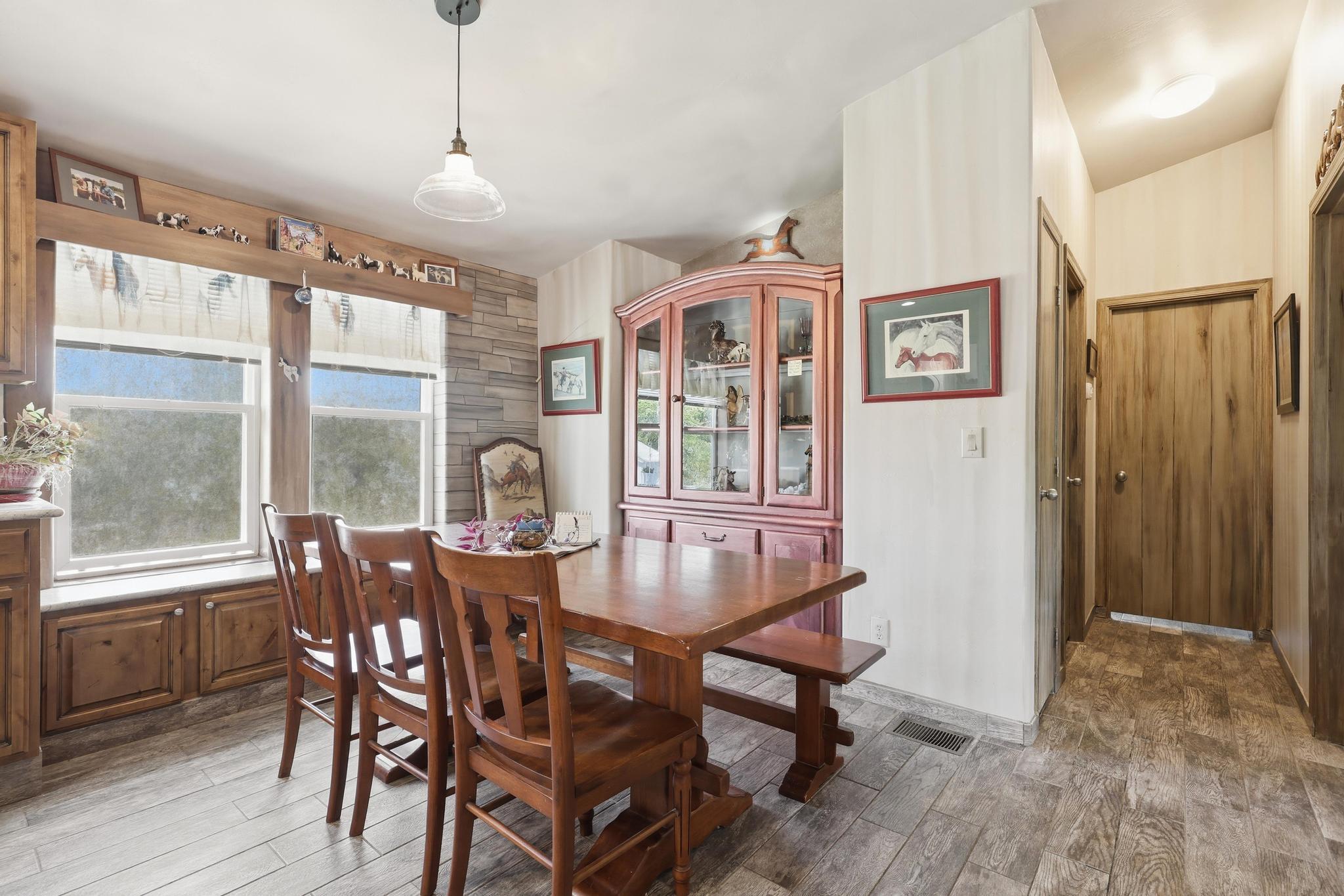 1211 Heather Circle Payson, AZ 85541 - Photo 7 of 51 a view of a dining room with furniture window and wooden floor