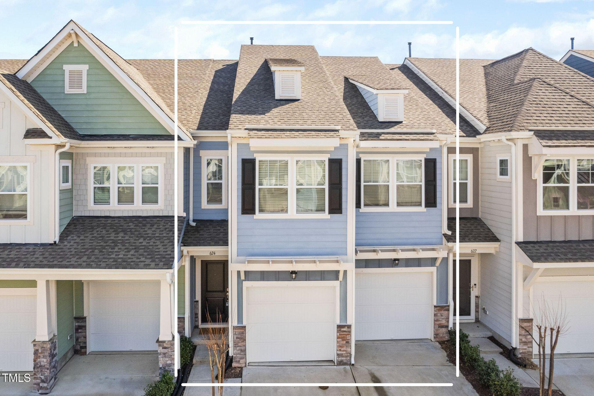 a view of a white house with large windows