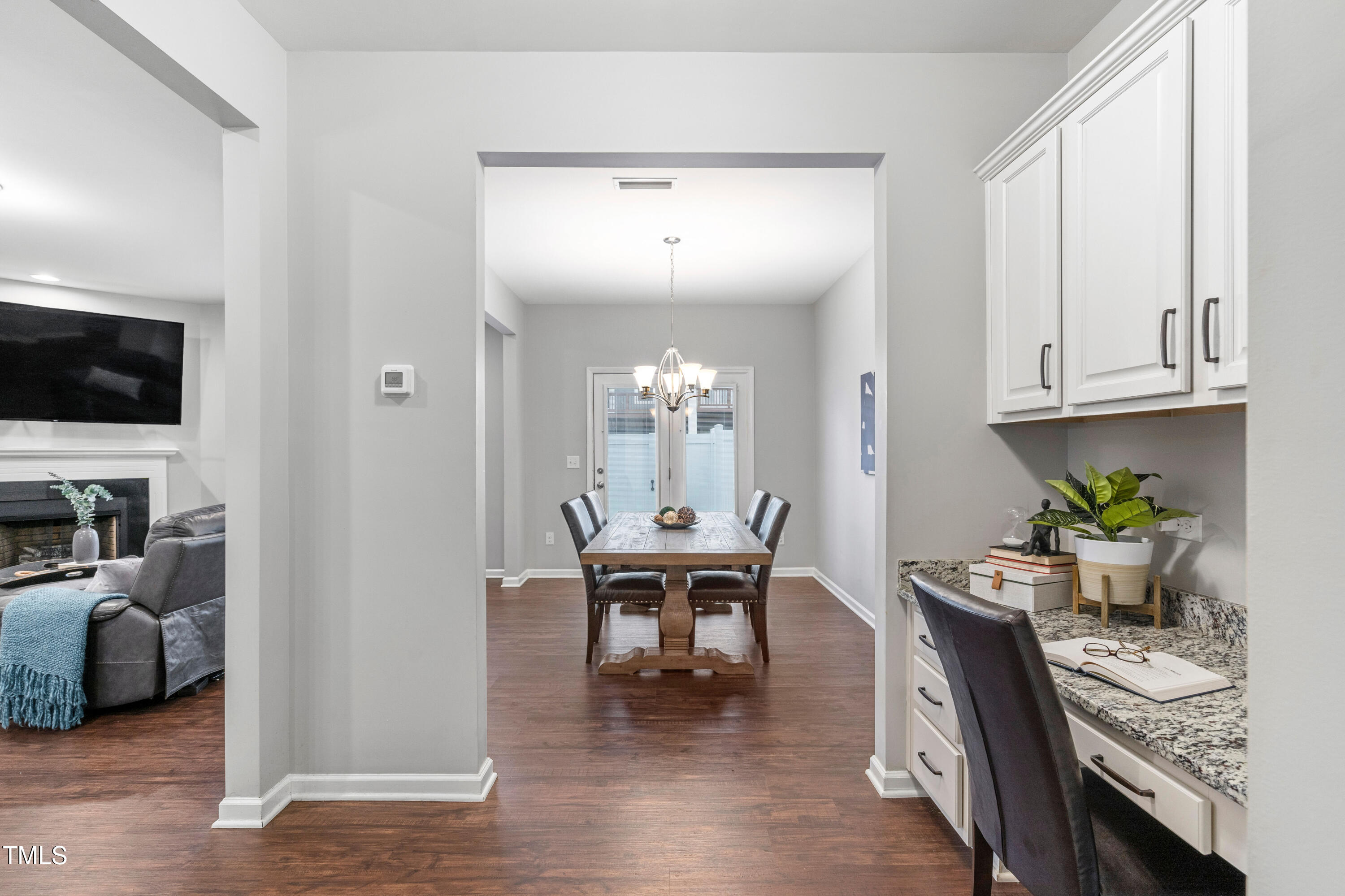624 Metro Station Apex, NC 27502 - Photo 14 of 36 a view of a dining room with furniture and a chandelier