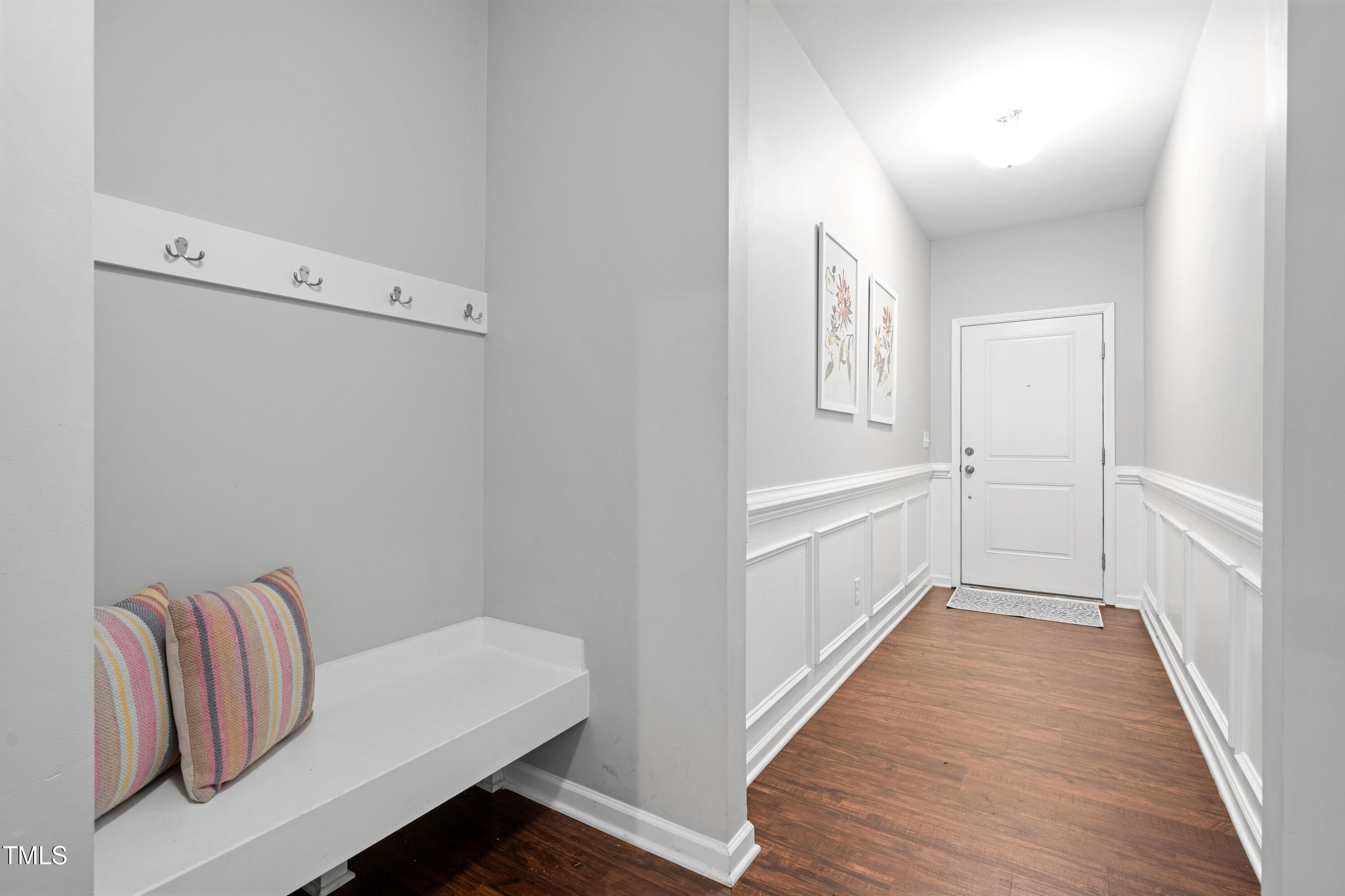 624 Metro Station Apex, NC 27502 - Photo 6 of 36 a hallway with white couches and white walls