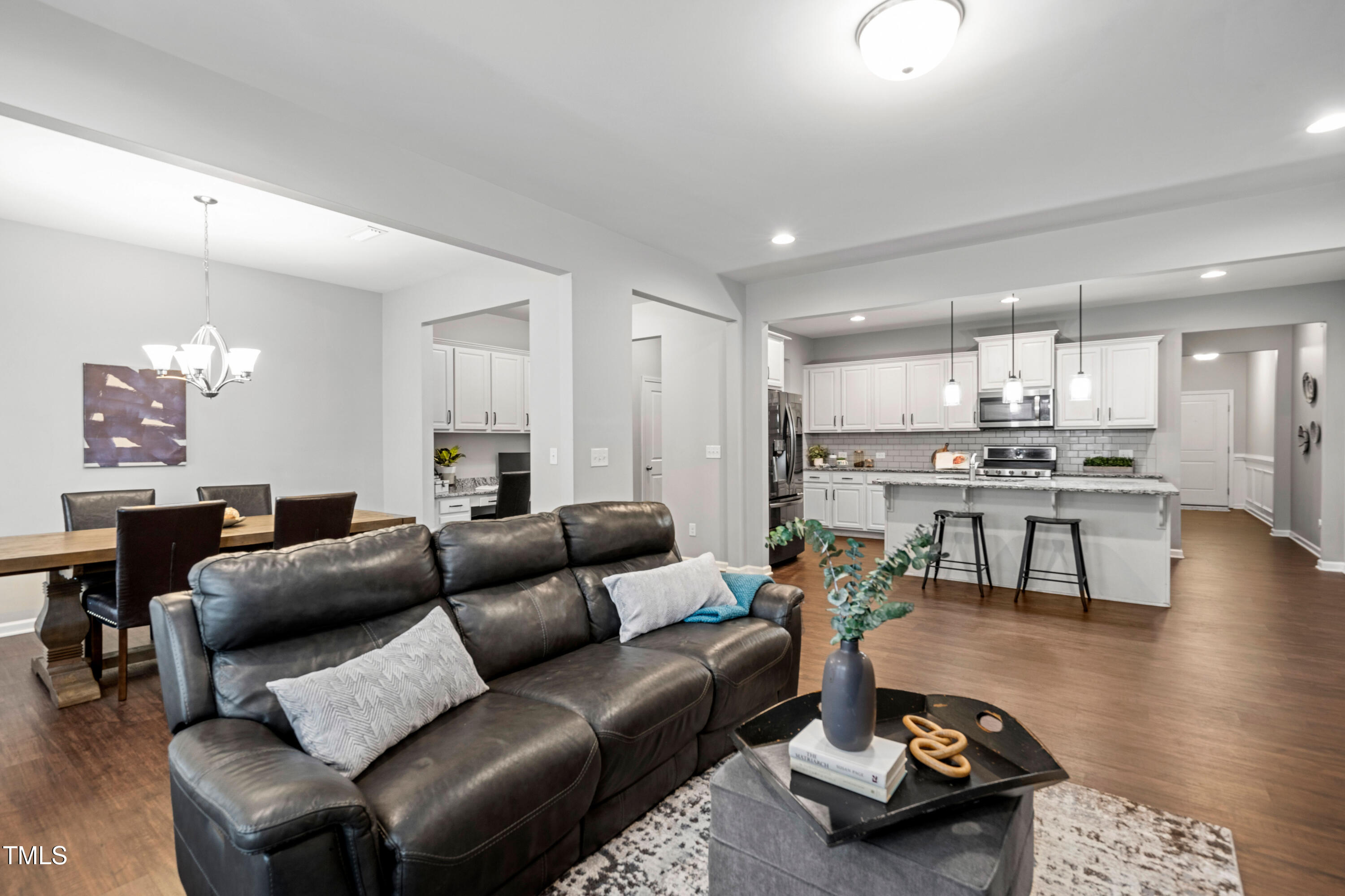 624 Metro Station Apex, NC 27502 - Photo 10 of 36 a living room with furniture and kitchen view