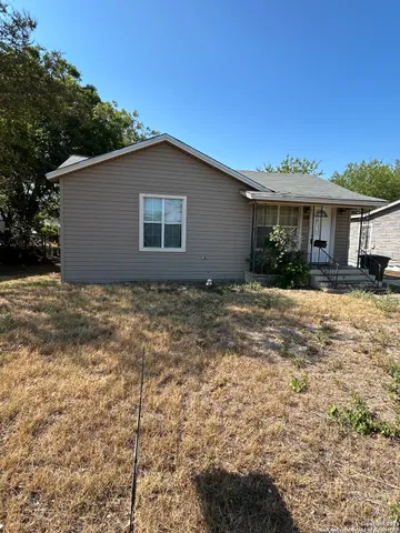 a house with a tree in front of it