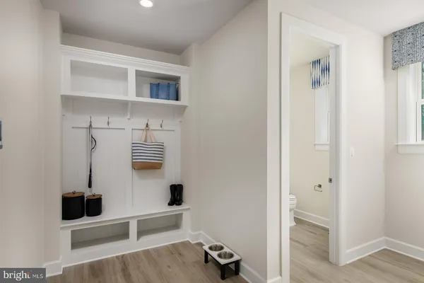 a view of hallway with seating area and front door
