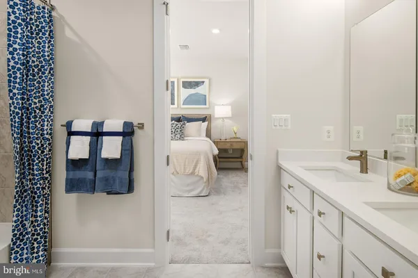 a en suite bathroom with a sink and a mirror