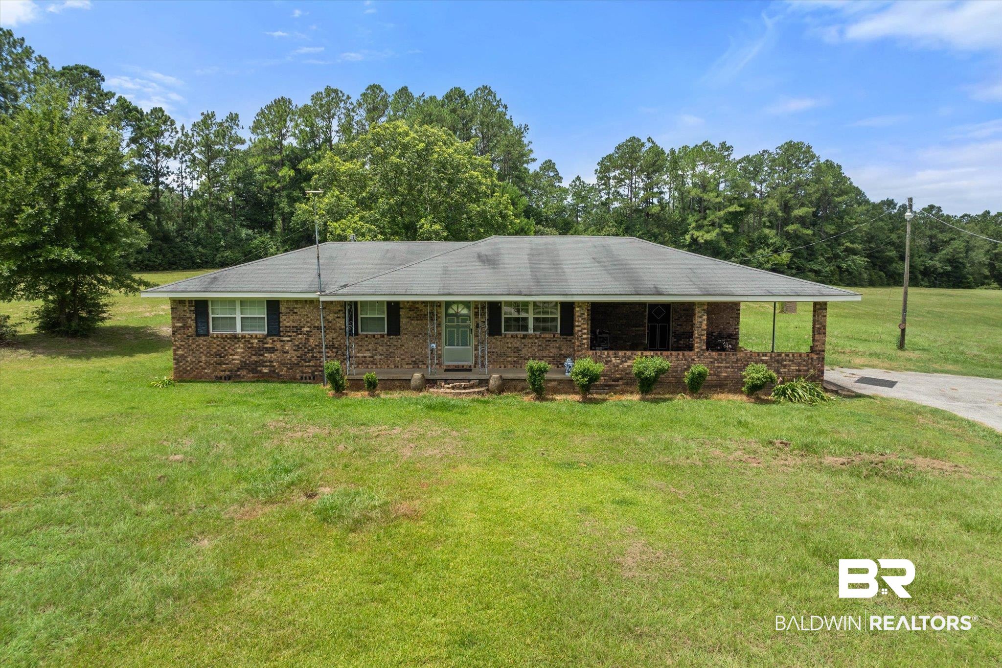 11601 Lott Road Chunchula, AL 36521 - Photo 18 of 34 Ranch-style house with a front yard and brick siding