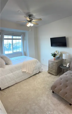 a bedroom with bed and window