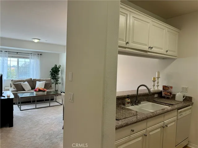 a kitchen with a sink and cabinets